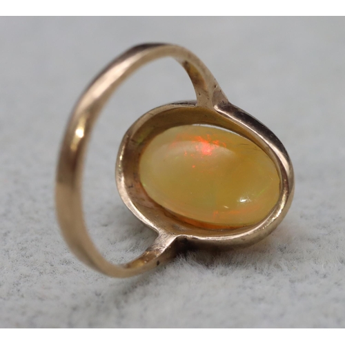 407 - A 9ct gold ladies' oval opal ring, Size L, 2.9 grams gross