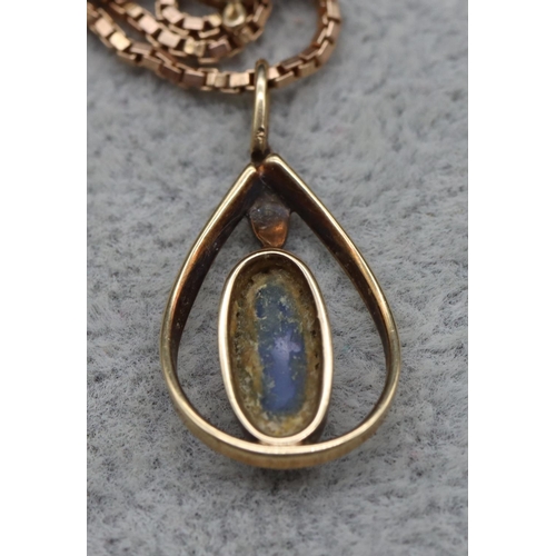 413 - A gold oval black opal pendant with square 9ct gold chain, 4.9 grams gross