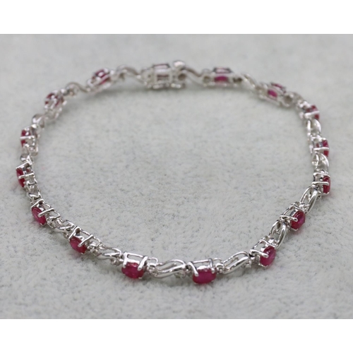 415 - A 14ct white gold bracelet set with small rubies and diamonds, 18.3cm long, 6.2 grams gross