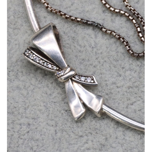 416 - A silver Pandora necklace with ribbon motif and square linked chain, 47.5cm long