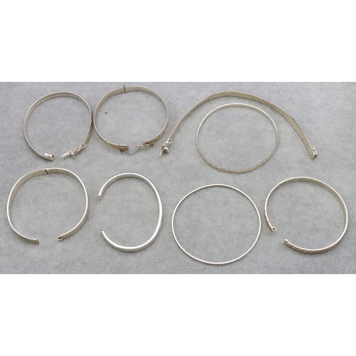 423 - 8 various silver bangles, 110 grams