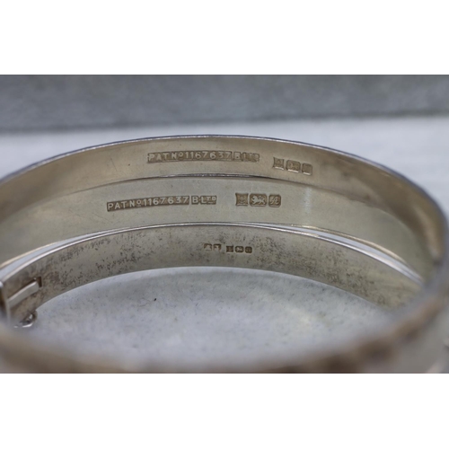 423 - 8 various silver bangles, 110 grams