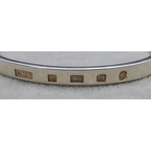 423 - 8 various silver bangles, 110 grams