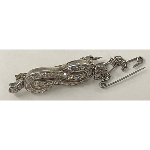 425 - A gold and platinum ribbon brooch inset with diamonds, 3.5cm wide, 4.1 grams gross