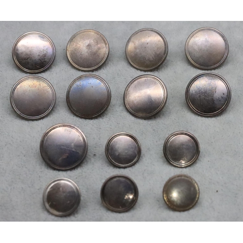 427 - A set of 9 silver circular buttons and 5 smaller similar buttons, 1.91oz