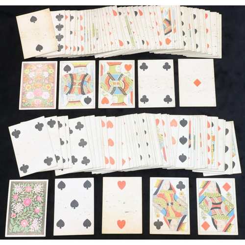 428 - 2 packs De la Rue London playing cards with multi-coloured floral and leaf decoration, both sets com... 