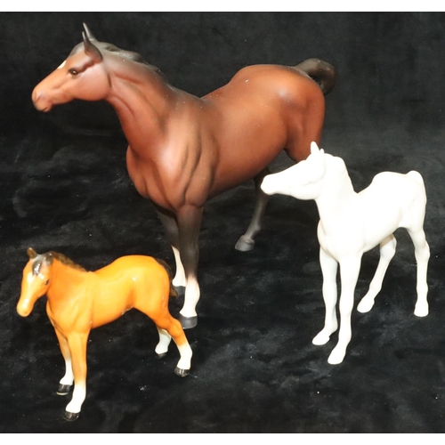 43 - A Beswick mat figure of a horse on brown ground, 21cm high, a Beswick mat figure of a foal on white ... 