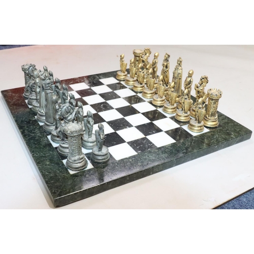 430 - A heavy gilt and silvered metal chess set in the form of King, Queen, Knights, Castles etc., King 10... 