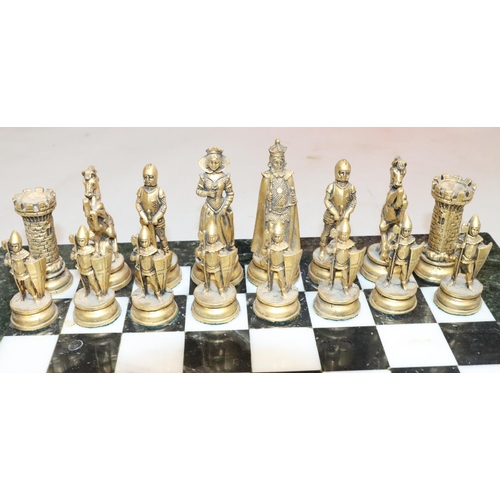 430 - A heavy gilt and silvered metal chess set in the form of King, Queen, Knights, Castles etc., King 10... 