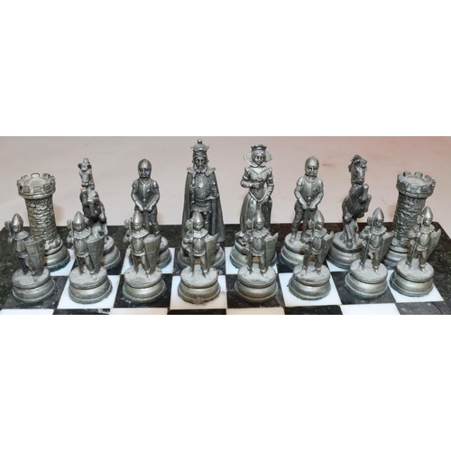 430 - A heavy gilt and silvered metal chess set in the form of King, Queen, Knights, Castles etc., King 10... 