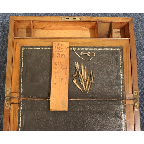 437 - A 19th Century mahogany rectangular shaped writing box with brass mounts and banding, hinged lid enc... 