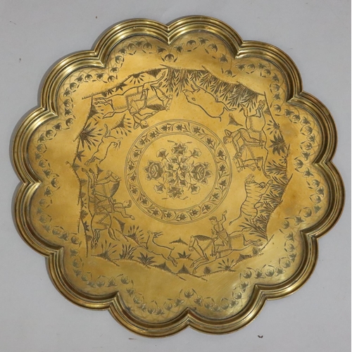 438 - 4 various copper and brass Islamic trays with allover embossed and engraved decoration, including a ... 