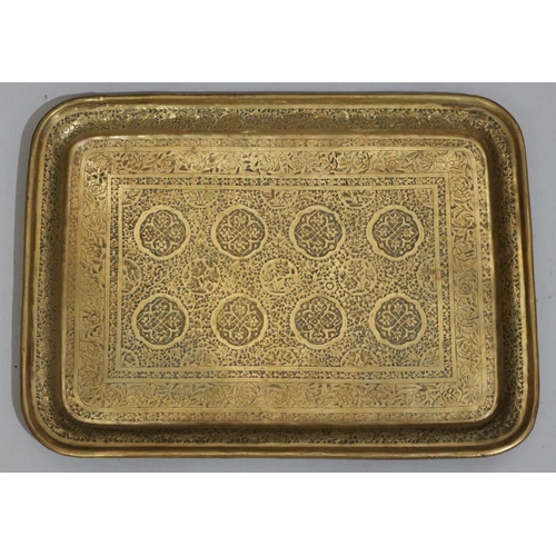 438 - 4 various copper and brass Islamic trays with allover embossed and engraved decoration, including a ... 