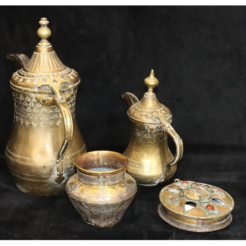 439 - An Islamic round bulbous shaped coffee pot, 29cm high, a smaller similar coffee pot, 20.5cm high, an... 