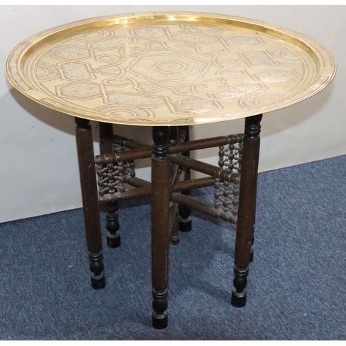 440 - An Islamic round brass coffee table with inlaid copper and silvered decoration, 70cm diameter, with ... 