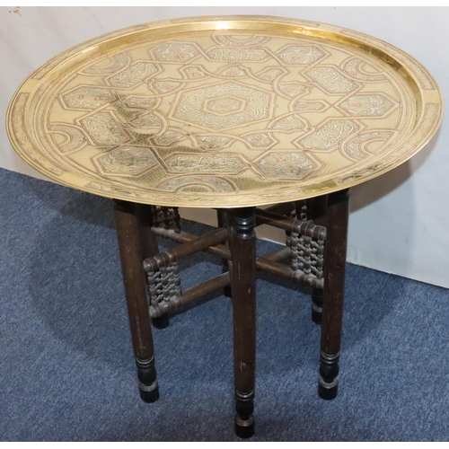 440 - An Islamic round brass coffee table with inlaid copper and silvered decoration, 70cm diameter, with ... 