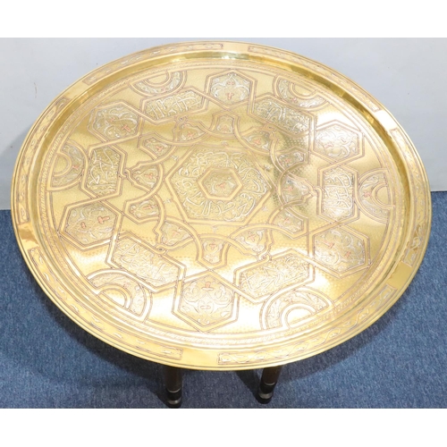 440 - An Islamic round brass coffee table with inlaid copper and silvered decoration, 70cm diameter, with ... 