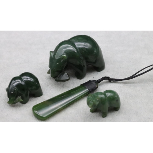 441 - A jade style figure of a polar bear, 2 smaller similar figures and a jade drop pendant with cord nec... 