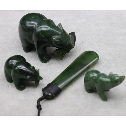 441 - A jade style figure of a polar bear, 2 smaller similar figures and a jade drop pendant with cord nec... 