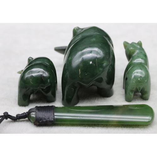 441 - A jade style figure of a polar bear, 2 smaller similar figures and a jade drop pendant with cord nec... 