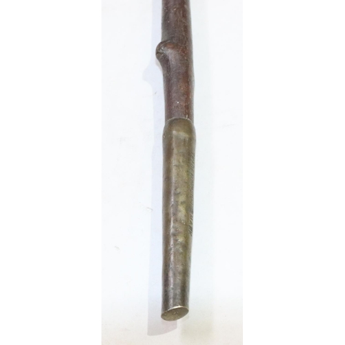 447 - A carved walking stick with figurehead motif, 86.5cm long overall