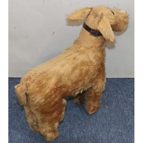 451 - An early Chiltern child's toy figure of a dog (no stand and in need of restoration), 47cm high, 53cm... 