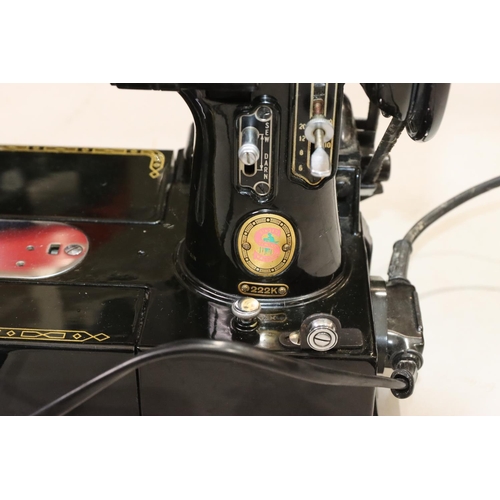 452 - A Singer 22K electric sewing machine, cased, with various accessories, instruction manual etc. (bar ... 