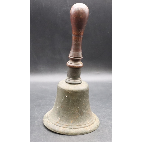 466 - A heavy school bell with turned wooden handle, 31cm high