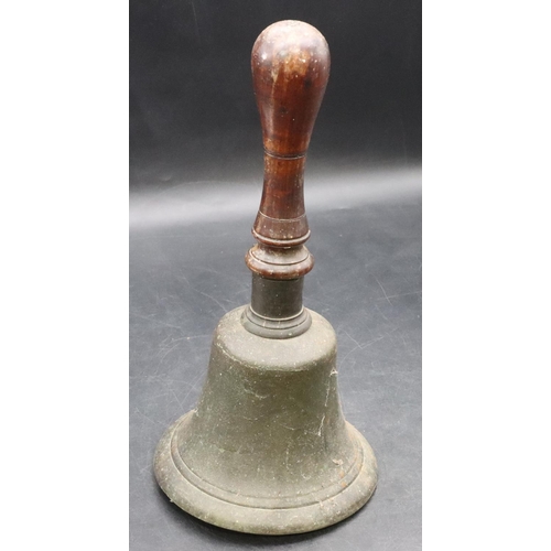 466 - A heavy school bell with turned wooden handle, 31cm high