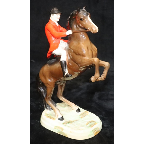 47 - A Beswick figure of huntsman on rearing horse, 868, 23.5cm high (1 ear chipped)