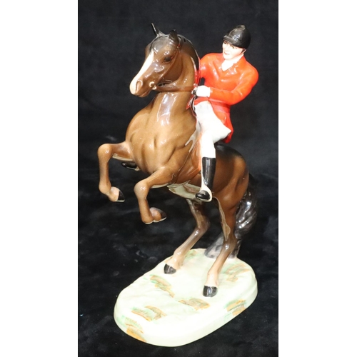 47 - A Beswick figure of huntsman on rearing horse, 868, 23.5cm high (1 ear chipped)