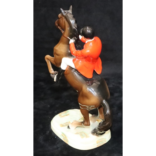 47 - A Beswick figure of huntsman on rearing horse, 868, 23.5cm high (1 ear chipped)