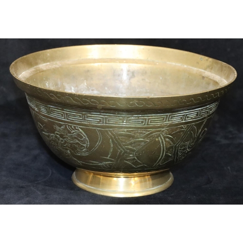 473 - An Oriental gilt bronze round trumpet shaped bowl with dragon key pattern decoration, 26.5cm diamete... 