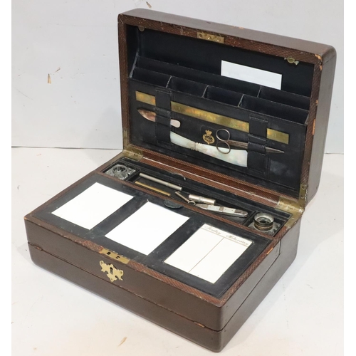 477 - A 19th Century Irish leather and wooden travelling writing box, stamped 