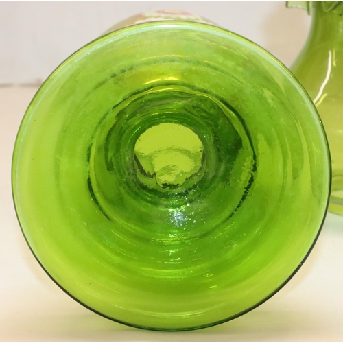 484 - A green glass oil lamp on round bulbous base with separate top, mounted with chimney and round bulbo... 