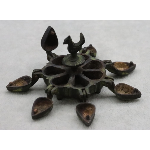 485 - A small Eastern bronze spice box with bird centre motif, 7.5cm wide