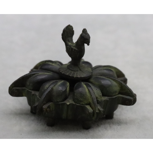 485 - A small Eastern bronze spice box with bird centre motif, 7.5cm wide