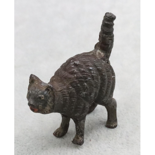 487 - A cold painted bronze style figure of a cat, 5cm long