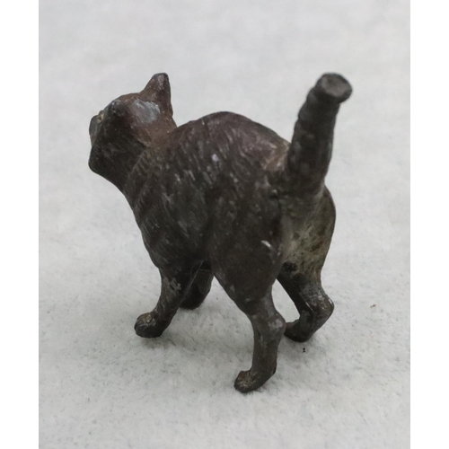 487 - A cold painted bronze style figure of a cat, 5cm long