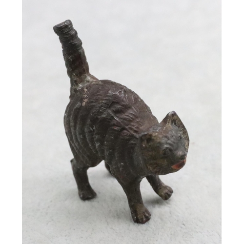 487 - A cold painted bronze style figure of a cat, 5cm long