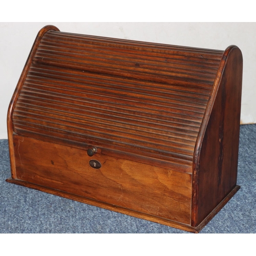 503 - A Victorian walnut tambour topped stationery box enclosing sectioned interior, 36cm wide, 25cm high