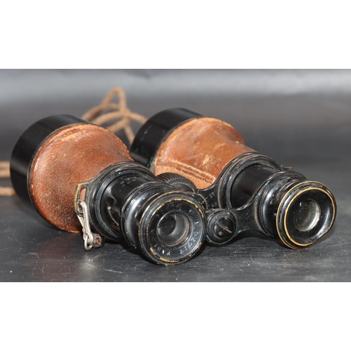 505 - A pair of military L.Petit Fab, Paris black and leather bound binoculars (cased), stamped 