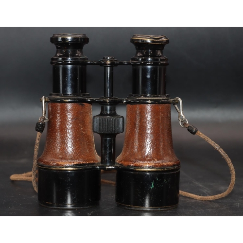 505 - A pair of military L.Petit Fab, Paris black and leather bound binoculars (cased), stamped 