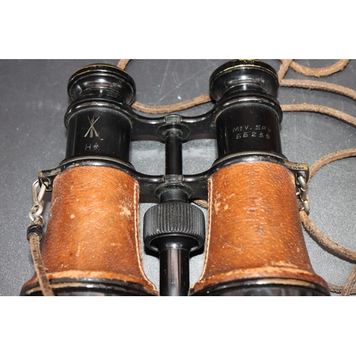 505 - A pair of military L.Petit Fab, Paris black and leather bound binoculars (cased), stamped 