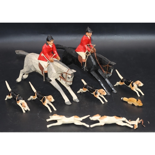 Frank Whittington, Forest Toys of Brockenhurst, carved fox hunting group, grey horse galloping with huntsman, 16cm high, a further rider on black horse, 15.5cm high, 4 dogs (1 tail chipped, legs of 2 dogs in need of restoration) and fox (9)