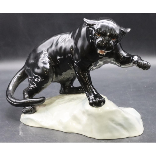 52 - A Beswick figure of a black Puma upon a rock, 1702, 21.5cm high