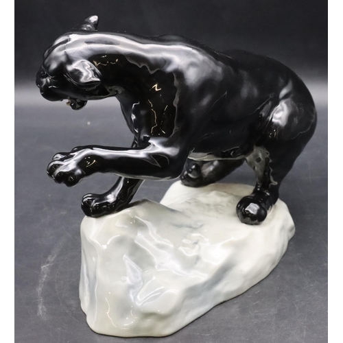 52 - A Beswick figure of a black Puma upon a rock, 1702, 21.5cm high