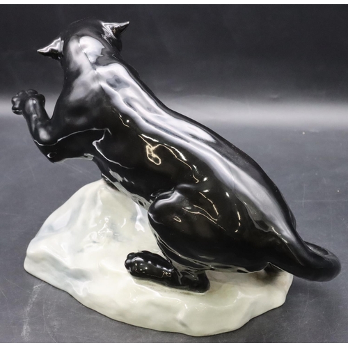 52 - A Beswick figure of a black Puma upon a rock, 1702, 21.5cm high