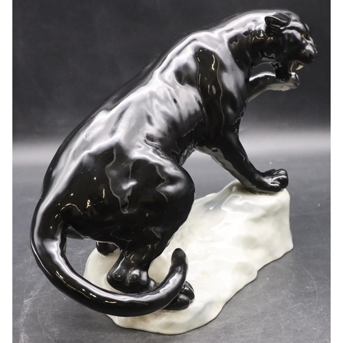 52 - A Beswick figure of a black Puma upon a rock, 1702, 21.5cm high