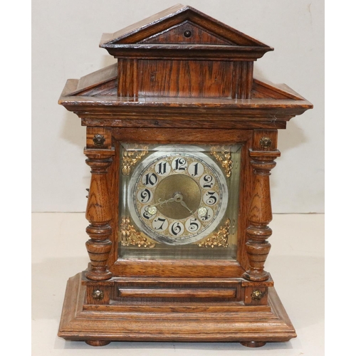 530 - An oak timepiece with half round column supports, square gilt dial with Arabic numerals (movement al... 